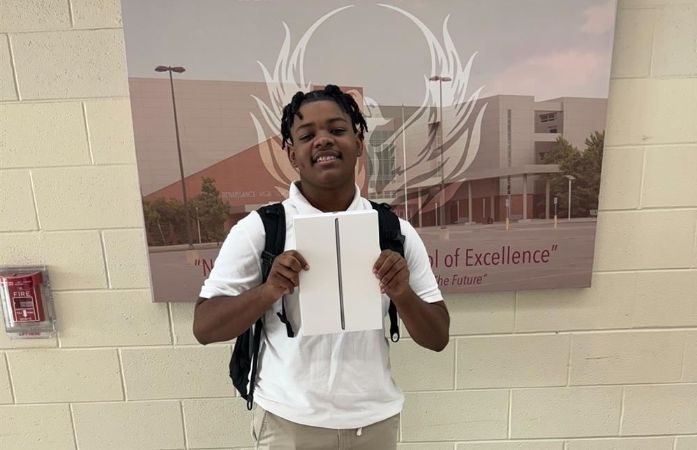   Cedric Dunson holding iPad